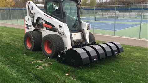 skid steer aerator attachment|cat skid steer loader attachments.